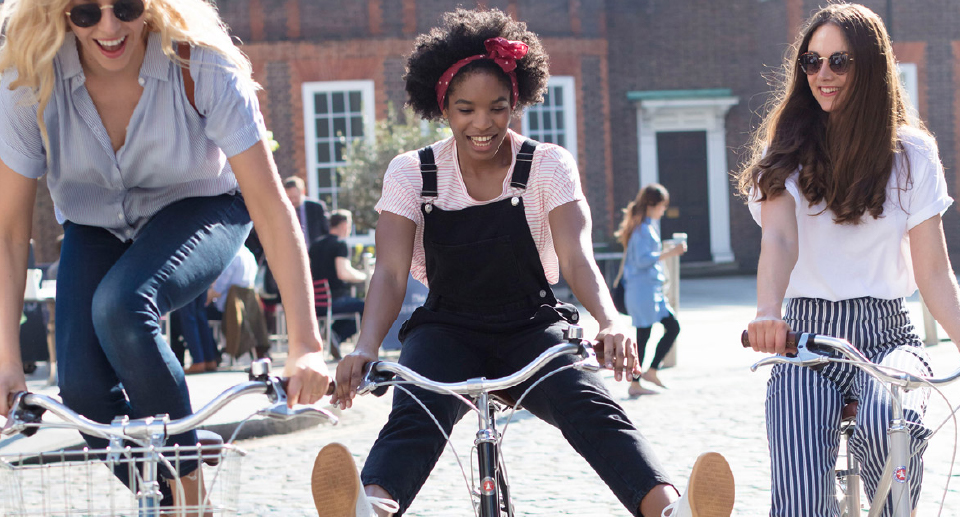 Harrogate Spring Water lifestyle photography of girls on a bike